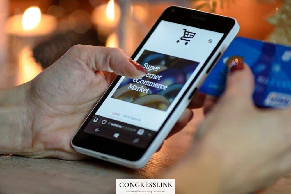 Person Using Black And White Smartphone and Holding Blue Card