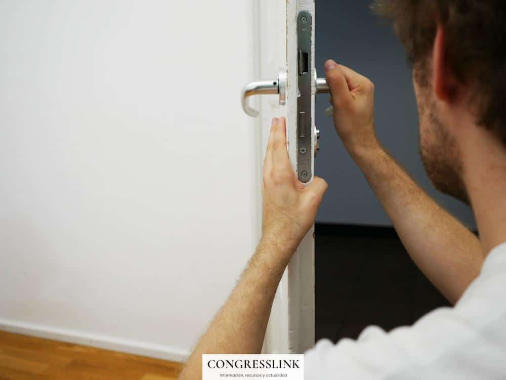 person holds door lever