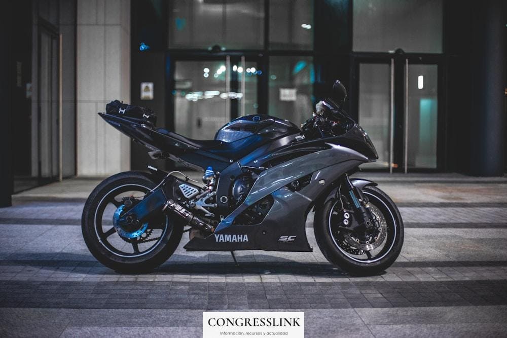 black Yamaha sports bike in front of building